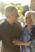Older Caucasian couple walking outdoors
