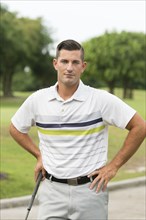 Caucasian man standing on golf course