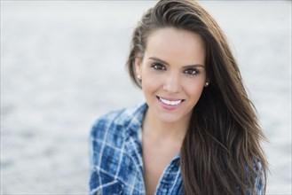 Hispanic woman smiling outdoors