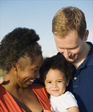 Multi-ethnic family smiling