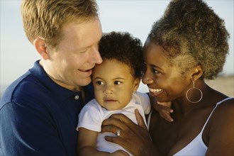 Multi-ethnic family smiling