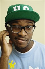 African American man in baseball cap and eyeglasses