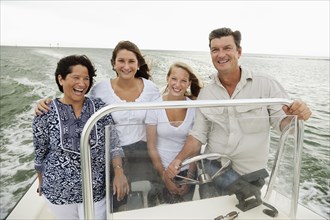 Smiling family boating outdoors