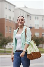 Caucasian student walking on campus