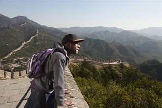 Black man standing on Great Wall of China