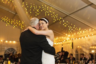 Bride dancing with father at reception