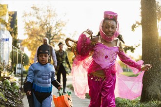 African American children trick-or-treating on Halloween