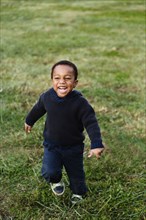 African American boy smiling in park