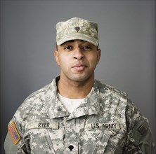 Close up of mixed race soldier smiling