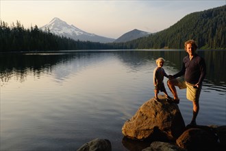 Caucasian father and son standing by Lost Lake