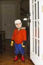 Caucasian boy wearing snow gear