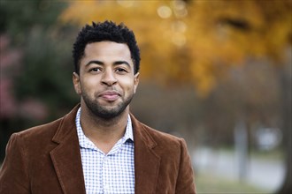 African American businessman smiling outdoors