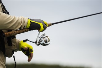 Caucasian man holding fishing rod