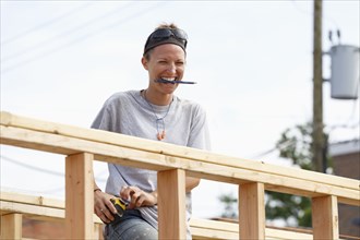 Caucasian woman laughing at construction site