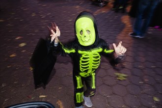 Caucasian boy wearing skeleton Halloween costume