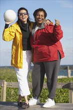 Two middle-aged women with volley ball