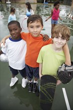 Multi-ethnic boys with sports gear