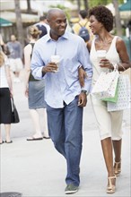 African American couple with shopping bags