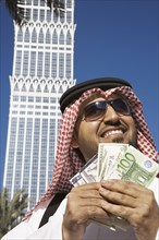 Arab man holding money