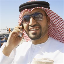 Close up of Arab man talking on cell phone