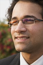 Close up of Indian businessman in eyeglasses