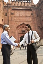 Indian businessman shaking hands at the Red Fort