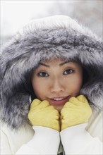 Korean woman in fur-hooded coat