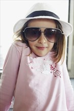 Italian girl in fedora and sunglasses