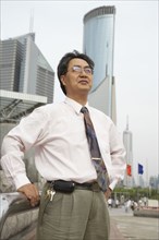 Chinese businessman standing outdoors