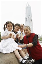 Chinese grandparents enjoying grandchildren