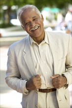 Smiling mixed race man standing outdoors