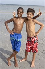 Playful boys enjoying the beach together