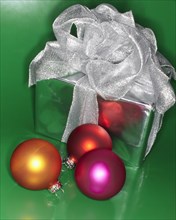 Festive Christmas gift with colored ornaments