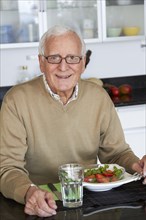 Caucasian man eating healthy salad