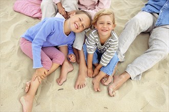 Caucasian children smiling on beach