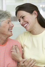 Mother and daughter hugging