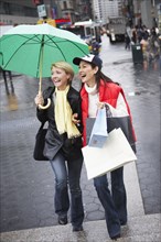 Women walking together on city street
