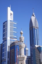 Dubai city skyline against blue sky