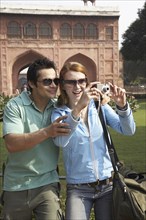 Couple taking pictures at Red Fort
