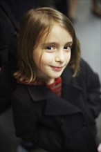 Smiling girl wearing winter coat