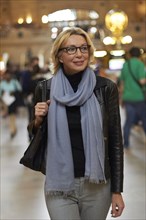 Caucasian woman walking in Grand Central Station
