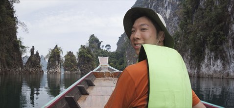 Asian man in boat