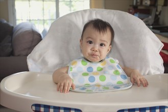 Chinese baby in high chair