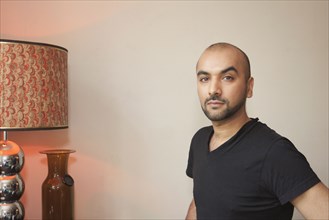 Mixed race man in living room
