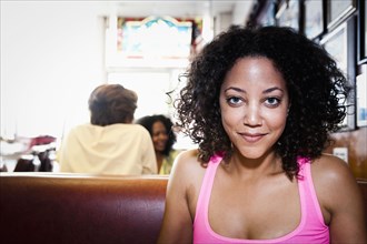 Smiling African American woman in diner