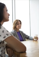 Businesswomen listening in meeting