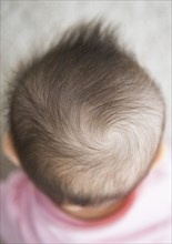 Close up of mixed race baby girl's hair