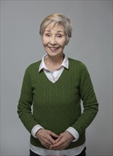 Close up of older Japanese woman smiling