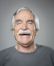 Close up of older Caucasian man laughing