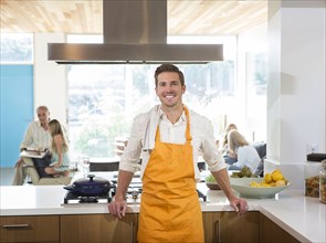 Caucasian man smiling in kitchen
